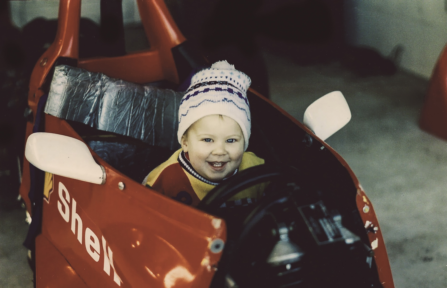 Jono Lester as a bady, sitting in a Formula Ford race car