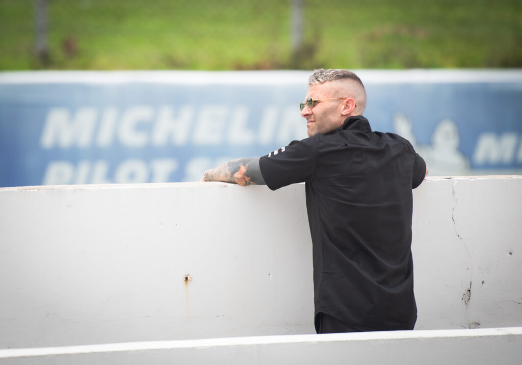 Jono Lester watching a coaching session trackside
