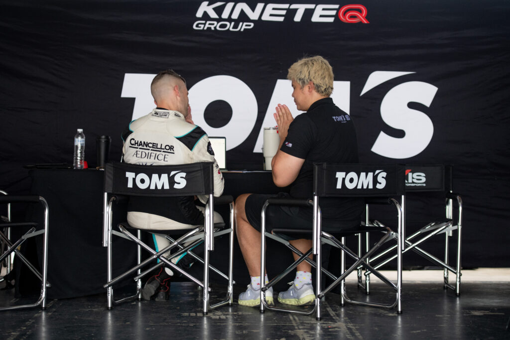 Jono Lester with a driver at the TOM'S Racing Thailand garage